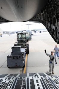 Joint Base McGuire-Dix-Lakehurst airmen load and secure equipment onto aircraft in preparation of Hurricane Irene Aug. 26, 2011. All JB MDL aircraft are being evacuated to Air Force Base's around the country.