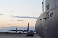 The sun sets beyond the Texas horizon as two C-130 Hercules remain ready for aerial firefighting support Sept. 10 at Austin-Bergstrom International Airport in Austin, Texas. Just hours before, Airmen assigned to units in Colorado and North Carolina arrived at the airport to form the 302nd Air Expeditionary Group, the Air Force's response to a U.S. Forest Service support request to aid in fighting wildfires. The 302nd AEG's mission is to provide aerial firefighting capabilities using the Modular Airborne Firefighting System, or "MAFFS" system.


