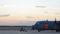 A Texas sun sets behind a North Carolina Air National Guard C-130 Hercules Sept. 10 at Austin-Bergstrom International Airport in Austin, Texas. Just hours before, Airmen assigned to units in Colorado and North Carolina arrived at the airport to form the 302nd Air Expeditionary Group, the Air Force's response to a U.S. Forest Service support request to aid in fighting wildfires. The 302nd AEG's mission is to provide aerial firefighting capabilities using the Modular Airborne Firefighting System, or "MAFFS" system.