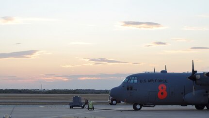 A Texas sun sets behind a North Carolina Air National Guard C-130 Hercules Sept. 10 at Austin-Bergstrom International Airport in Austin, Texas. Just hours before, Airmen assigned to units in Colorado and North Carolina arrived at the airport to form the 302nd Air Expeditionary Group, the Air Force's response to a U.S. Forest Service support request to aid in fighting wildfires. The 302nd AEG's mission is to provide aerial firefighting capabilities using the Modular Airborne Firefighting System, or "MAFFS" system.