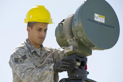 U.S. Air Force Senior Airman Horacio Maysonet from the 51st Combat Communications Squadron, Robins Air Force Base,  Ga., perform set up and testing on radio frequency modules (RFM) Naval Air Station (NAS) Key West, Fla., Nov. 5, 2011.  The RFM consolidates radar feeds extending long distances into one air picture allowing higher headquarters to access and engage incoming threats.  The exercise in Key West will be the "first-ever proof of concept" for the military's Joint Deployable Integrated Air and Missile Defense System, a collection of high-end radars and missile systems as well as aircraft that work in tandem in the event of a threat to the continental United States.  
