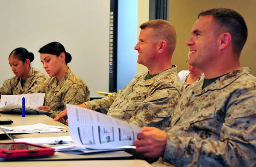 Marines listen and take notes during the Transition Readiness Seminars’ “10 Steps to a Federal Resume” workshop July 16, 2013, at the Religious Annex aboard Marine Corps Base Quantico. The goal was to help military members, civilians and military spouses improve their resume and navigate the federal hiring process.