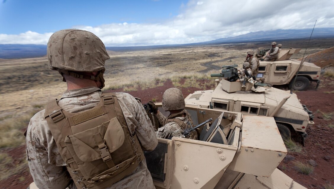 Marines with Combined Anti-Armor Team 1 Bravo fire heavy machine guns from a support-by-fire position in support of a company-level mechanized live-fire assault Echo Company,2nd Battalion, 3rd Marine Regiment conducted at Pohakuloa Training Area, Hawaii, July 19, 2013. (U.S. Marine Corps photo by Cpl. Matthew Callahan)