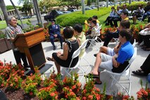 Former U.S. Army Capt. Myron “Skip” Kawakami, Bronze Star recipient, addresses the crowd during his Bronze Star medal ceremony at the 15th Wing headquarters building on Joint Base Pearl Harbor-Hickam, Hawaii, July 26, 2013. Kawakami thanked the men and women of the 15th WG for presenting the Bronze Star for his time served in the Vietnam War. (U.S. Air Force photo/Tech. Sgt. Jerome S. Tayborn)