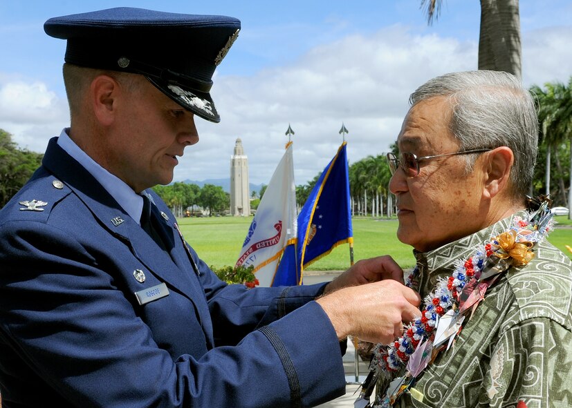 Col. Johnny Roscoe, 15th Wing commander, pins a Bronze Star on former U.S. Army Capt. Myron “Skip” Kawakami during his decoration ceremony at the 15th WG headquarters building on Joint Base Pearl Harbor-Hickam, Hawaii, July 26, 2013. The Bronze Star Medal is an individual military award of the United States Armed Forces. It may be awarded for acts of heroism, acts of merit, or meritorious service in a combat zone.  (U.S. Air Force photo/Tech. Sgt. Jerome S. Tayborn)