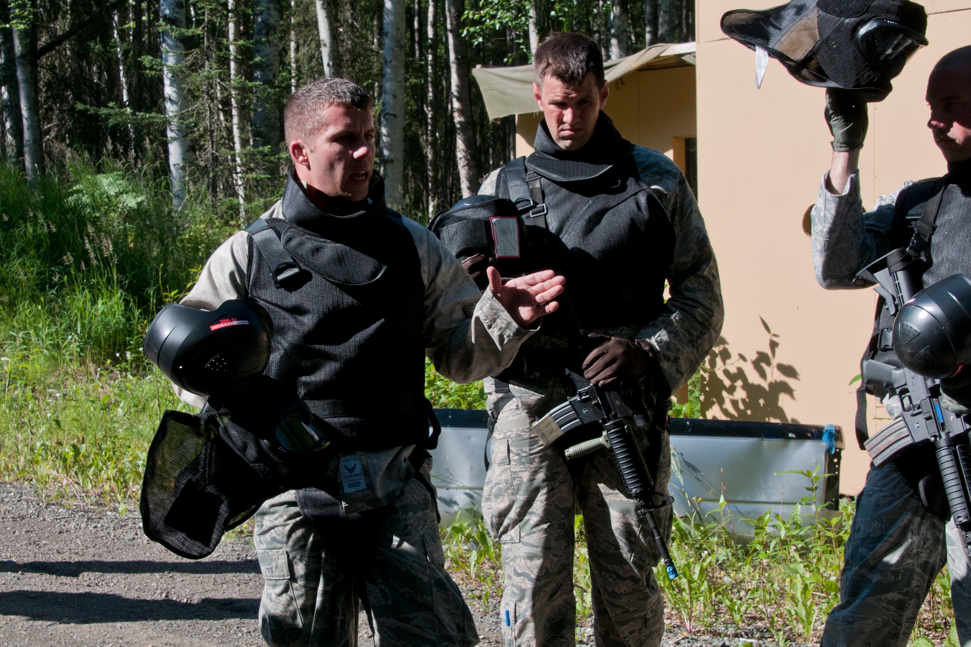 JOINT BASE ELMENDORF-RICHARDSON, Alaska -- Staff Sgt. Frank Watts, a 176 Security Forces trainer, Alaska Air National Guard, briefs Ohio Air Guardsmen as they practice squad movement tactics and react-to-contact training here July 24, 2013. Fifteen members of the 179th Security Forces Squadron, Ohio Air National Guard, along with 28 other members within their wing, performed annual training here. (U.S. Air National Guard photo by Staff Sgt N. Alicia Halla/Released)