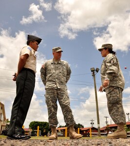 U.S. Army Col. Thomas D. Boccardi, Joint Task Force-Bravo commander, center, speaks to Cadet Beatriz Martorell, a West Point junior, and 2nd Lt. Isaac Martorell, West Point graduate and brother of Beatriz,  here about their future aspirations July 24, 2013. Beatriz had the unique opportunity to return to her home country and perform Cadet Leadership Training at the Honduran Presidential House as well at Soto Cano Air Base. (Photo released by U.S. Air Force Staff Sgt. Jarrod R. Chavana) 