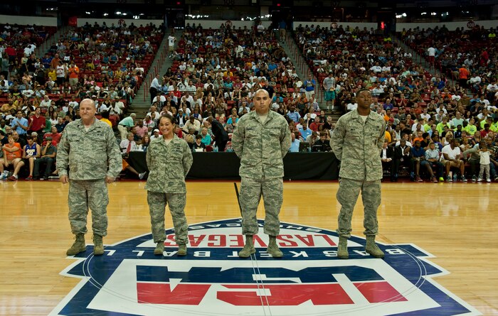 Airmen from Nellis and Creech Air Force Bases are recognized during the third quarter of the USA White vs. Blue Basketball game at the Thomas and Mack Center July 25, 2013, in Las Vegas. Three of the recognized Airmen recently returned from a deployment and one is a Wounded Warrior. (U.S. Air Force photo by Senior Airman Daniel Hughes)