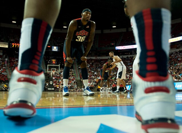 DeMarcus Cousins, USA Men’s Blue team player, waits as a player on the white team passes the ball inbounds during the USA Blue Basketball game at the Thomas and Mack Center July 25, 2013, in Las Vegas. Cousins and the Blue team took an early lead in the first half but came up short losing 128-106. The USA Basketball Association invited four Airmen from Nellis and Creech Air Force Bases who recently came home from deployment and one, a wounded warrior, to recognize them during the game. (U.S. Air Force photo by Senior Airman Daniel Hughes)  