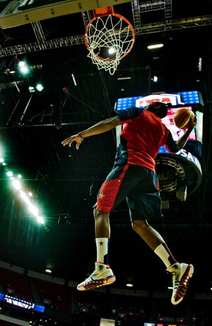 John Wall, USA Men’s Blue team player, throws down a dunk before playing in the USA Blue vs. White Basketball game at the Thomas and Mack Center July 25, 2013, in Las Vegas. USA Basketball is a nonprofit organization and the national governing body for men's and women's basketball in the United States. The USA Basketball Association invited four Airmen from Nellis and Creech Air Force Bases who recently came home from deployment and one, a wounded warrior, to recognize them during the game. (U.S. Air Force photo by Senior Airman Daniel Hughes)  