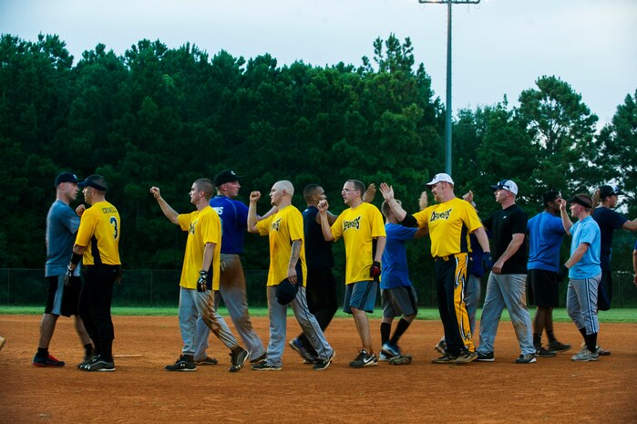 Players from the 437th Maintenance Squadron and 628th Security Forces Squadron shake hands after the Intramural Softball Base Championship game July 13, 2013, at Joint Base Charleston – Air Base, S.C. The 437th MXS defeated the 628th SFS 14 – 11. (U.S. Air Force photo/Senior Airman George Goslin) 