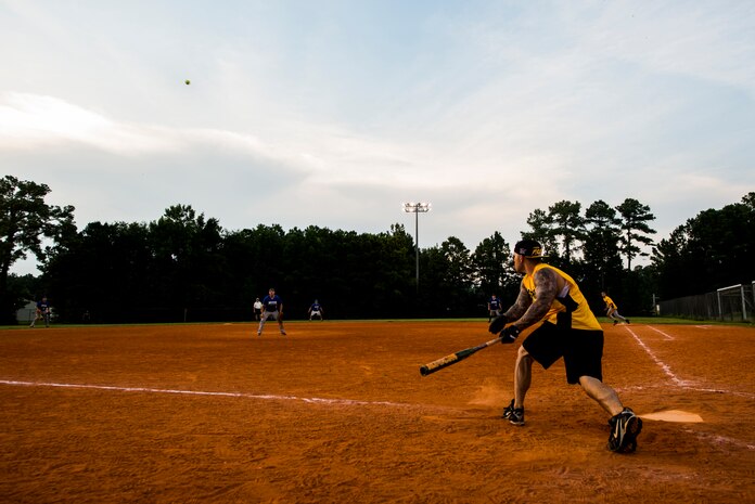 Clifford Hartley, 628th Security Forces Squadron, drives a ball to the outfield, during the Intramural Softball Championship Game against the 437th Maintenance Squadron July 24, 2013 at Joint Base Charleston – Air Base, S.C. The 437th MXS defeated the 628th SFS 14 – 11. (U.S. Air Force photo/Senior Airman George Goslin)