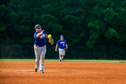 Austin Wild, 437th Maintenance Squadron pitcher and coach, delivers a pitch during the Intramural Softball Championship Game July 24, 2013, at Joint Base Charleston – Air Base, S.C. The 437th MXS defeated the 628th Security Forces Squadron 14 – 11, for the championship. (U.S. Air Force photo/Senior Airman George Goslin)
