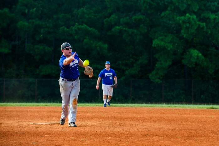 Austin Wild, 437th Maintenance Squadron pitcher and coach, delivers a pitch during the Intramural Softball Championship Game July 24, 2013, at Joint Base Charleston – Air Base, S.C. The 437th MXS defeated the 628th Security Forces Squadron 14 – 11, for the championship. (U.S. Air Force photo/Senior Airman George Goslin)