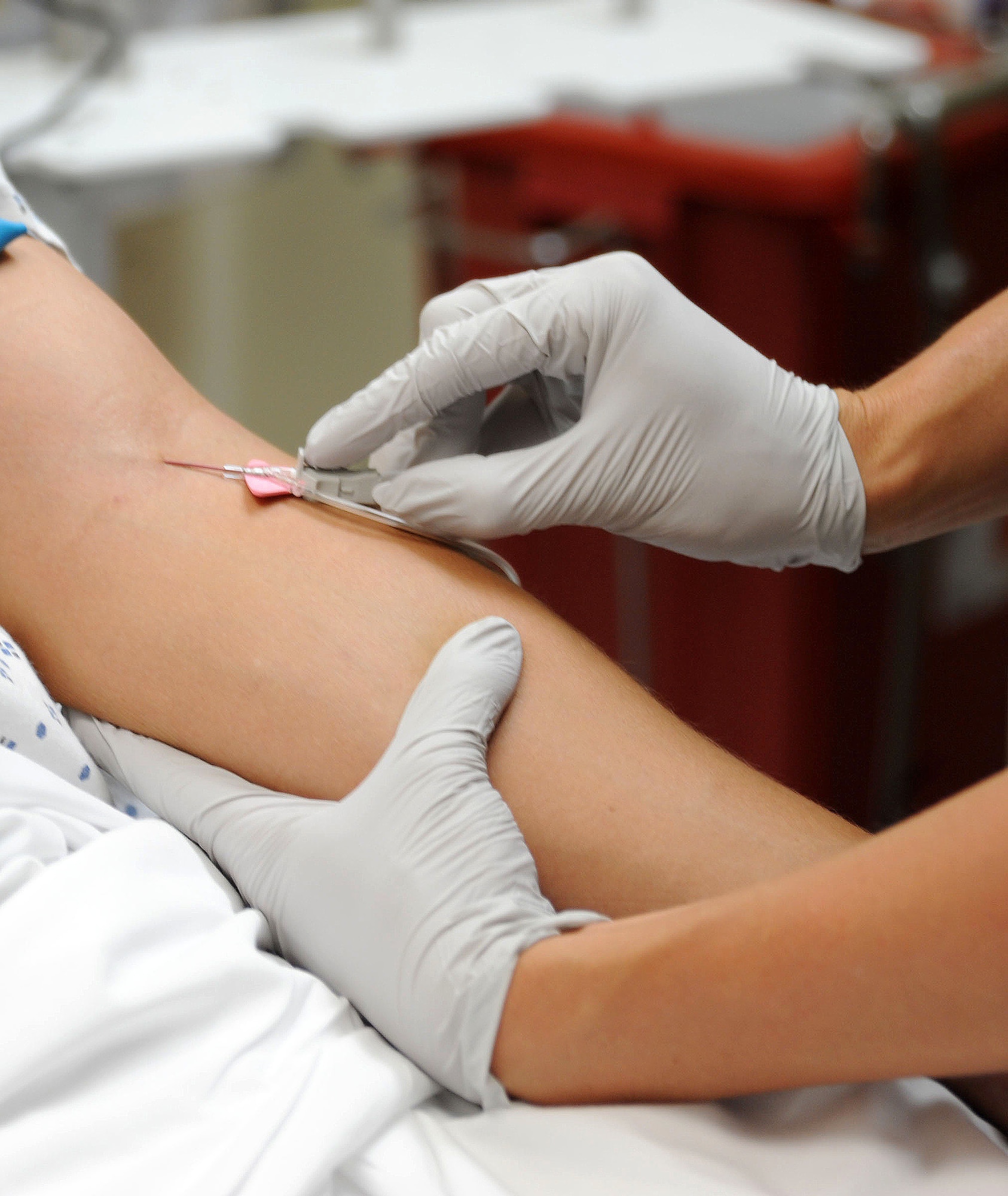1st Lt. Sabrina Macalister, 79th Medical Wing clinical nurse, gives a patient an IV during a training session July 16, 2013, at the Malcolm Grow Medical Clinic and Surgery Center Emergent Care Center on Joint Base Andrews, Md. The MGMCSC professionals maintain medical readiness for worldwide contingencies with 1,373 staff members and 69 residents. (U.S. Air Force photo Tech. Sgt. Tammie Moore)