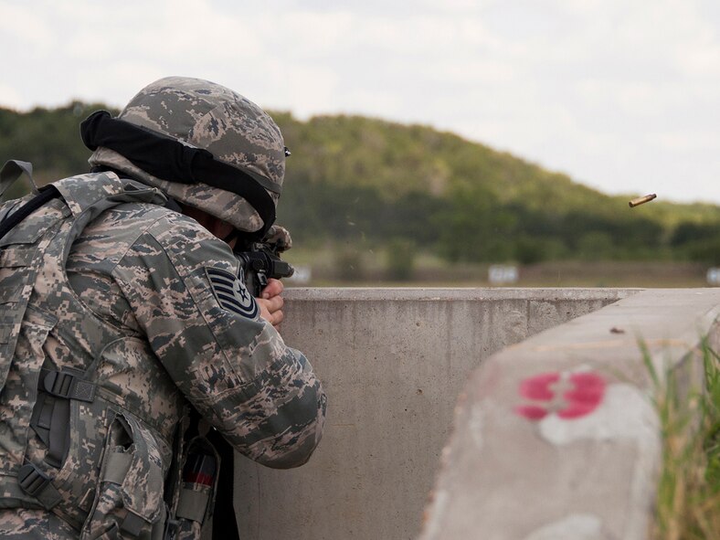 Tech. Sgt. Nathan Yeaman, 419th Security Forces Squadron, shoots at pop-up targets on Fort Wolters’ 300-meter firing range. Members shot 40 rounds, aiming to hit targets at distances between 25 and 300 meters. “The range here brings a more realistic feeling to the training,” Yeaman said. "You have the silhouette of an actual human popping up, and when you hit it, the target actually falls, which is pretty satisfying to see.” (U.S. Air Force photo/Senior Airman Crystal Charriere)