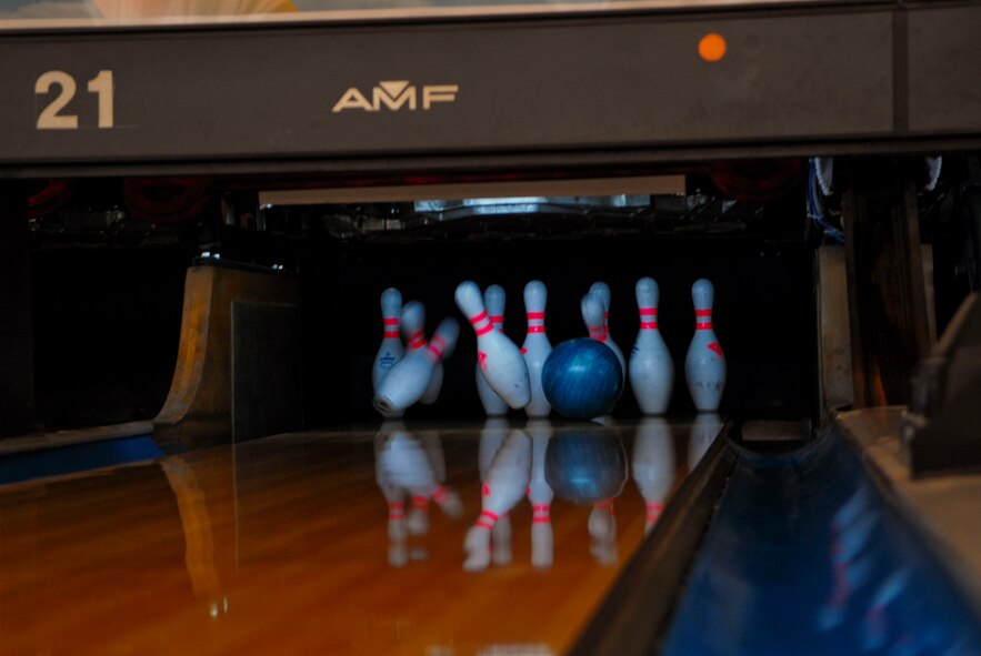 Daniel Blazier, 56th Operations Support Squadron, knocks down nine pins on his first throw during the eighth frame July 20 at the bowling event. Blazier picked up the spare. Airmen participating in the program receive a free bowling ball and bag. (U.S. Air Force photo/Senior Airman David Owsianka)