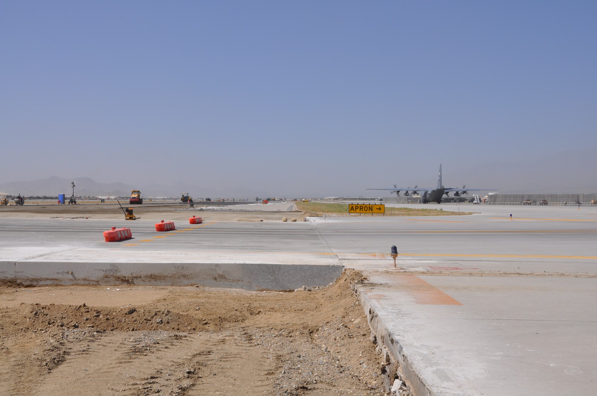 Ongoing runway repairs take place at Bagram Airfield, Afghanistan, July 26, 2013. The first phase of a major runway project on the Department of Defense’s busiest runway is scheduled to be completed here Aug. 10. Phase I included the repair and resurfacing of the Russian runway, built in 1959, to allow it to become a temporary runway while the primary runway is repaired. Soon after, the contractor will start Phase II work on the primary runway, which will last four months. (U.S. Air Force photo/Tech. Sgt. Rob Hazelett)