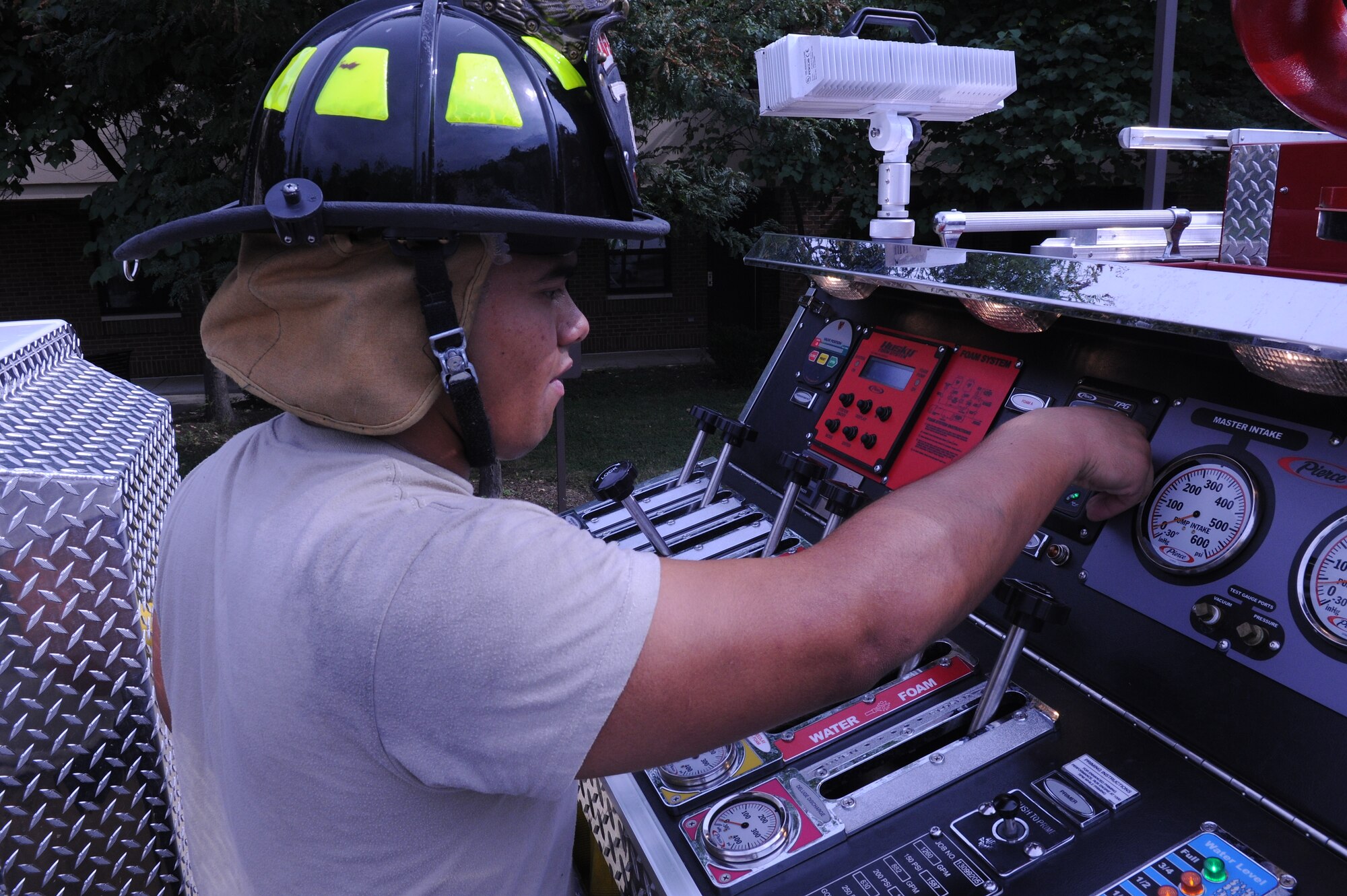 Airman 1st Class Patrick Gilbert, 11th Civil Engineer Squadron firefighter, operates his fire truck’s control panel here at Joint Base Andrews, Md., July 24, 2013. Firemen train to become experts in all aspects of their job. (U.S. Air Force photo/Airman 1st Class Joshua R. M. Dewberry)