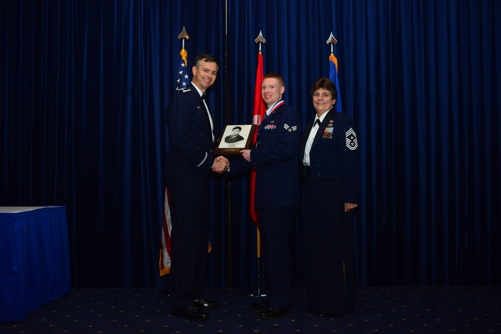 Senior Airmen Chad McCord, 39th Operations Squadron, receives the John L. Levitow Award from Col. Craig Wills, 39th Air Base Wing commander, during the Airmen Leadership School graduation July 25, 2013, at Incirlik Air Base, Turkey. The Levitow Award is the highest achievement for enlisted Airmen enrolled in U.S. Air Force professional military education. There are four levels of PME: ALS, NCO Academy, Air Force Senior NCO Academy and Chief Master Sergeant Leadership Course.