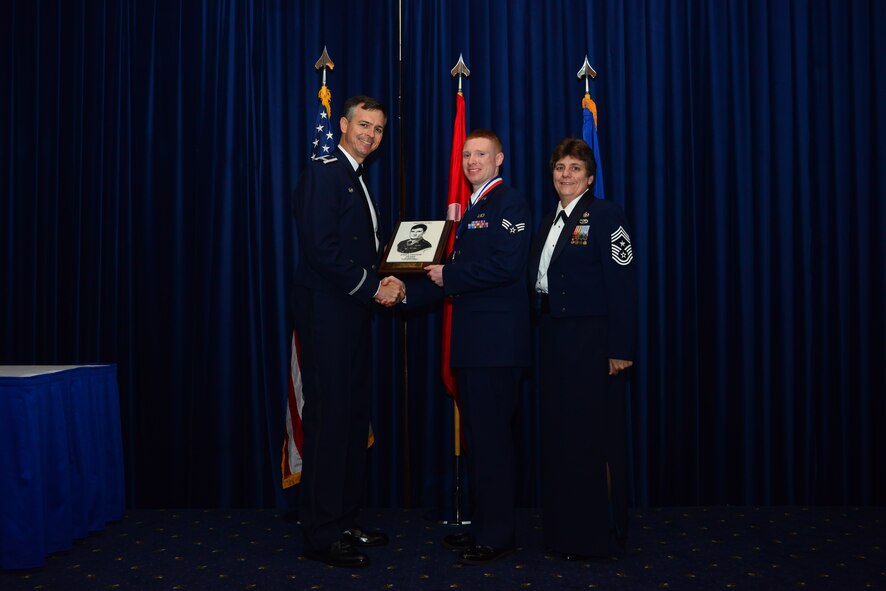Senior Airmen Chad McCord, 39th Operations Squadron, receives the John L. Levitow Award from Col. Craig Wills, 39th Air Base Wing commander, during the Airmen Leadership School graduation July 25, 2013, at Incirlik Air Base, Turkey. The Levitow Award is the highest achievement for enlisted Airmen enrolled in U.S. Air Force professional military education. There are four levels of PME: ALS, NCO Academy, Air Force Senior NCO Academy and Chief Master Sergeant Leadership Course.