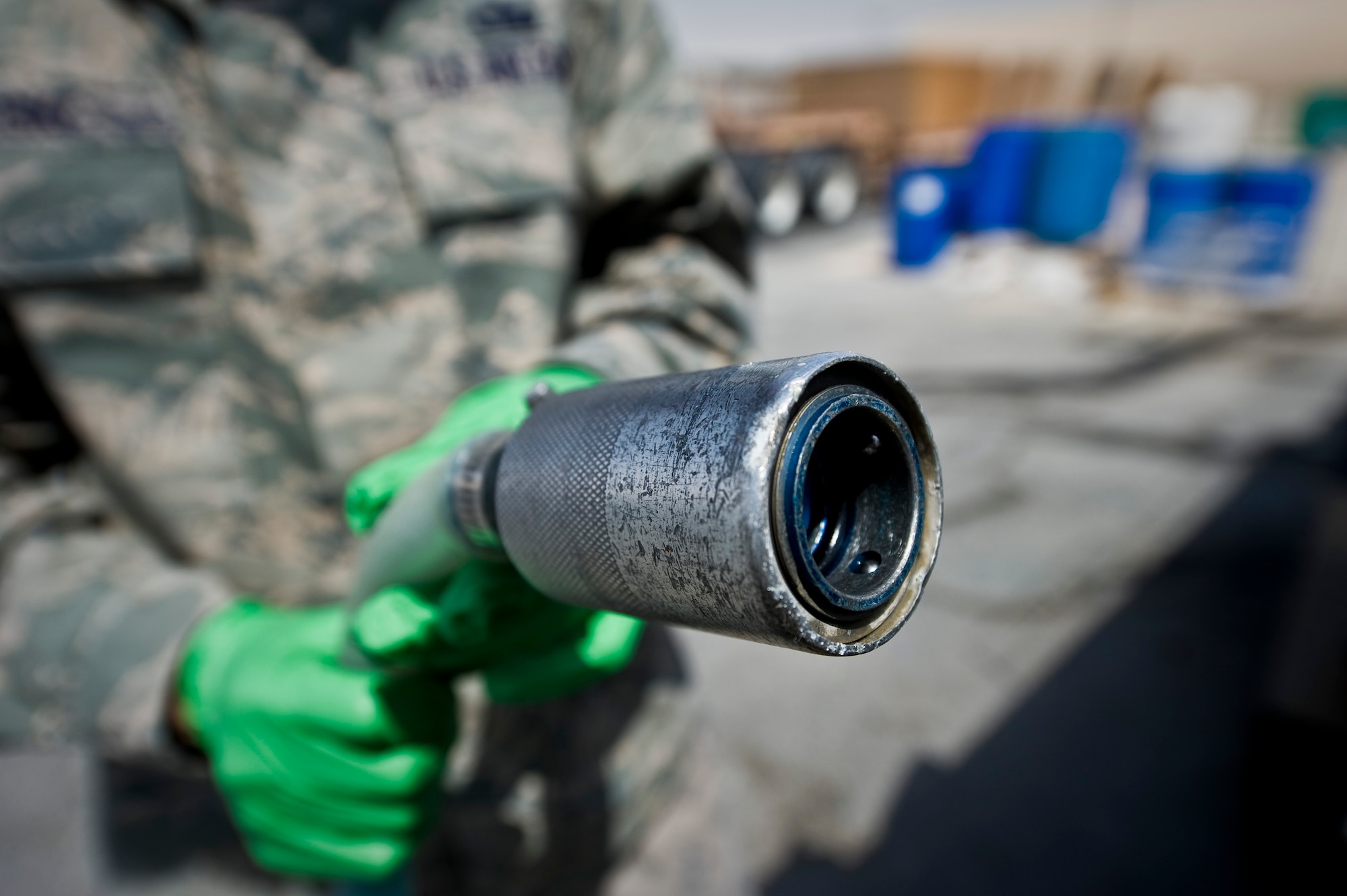 Tech. Sgt. Christopher Breski inspects a hose used by the lavatory service truck during aircraft waste recovery at the 379th Air Expeditionary Wing in Southwest Asia, July 22, 2013. Breski is the 8th Expeditionary Air Mobility Squadron fleet services NCO in charge deployed from Joint Base McGuire-Dix-Lakehurst, N.J. (U.S. Air Force photo/Senior Airman Benjamin Stratton)