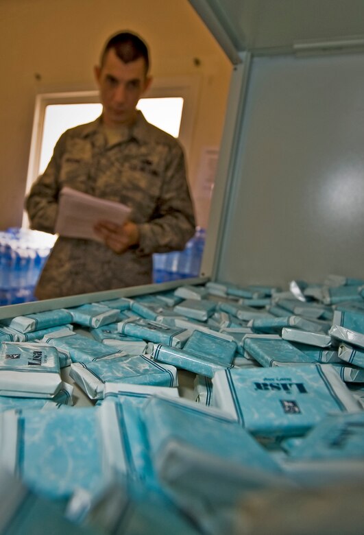 Tech. Sgt. Christopher Breski reviews "expendable" item inventories at the 379th Air Expeditionary Wing in Southwest Asia, July 22, 2013. Breski is the 8th Expeditionary Air Mobility Squadron fleet services NCO in charge deployed from Joint Base McGuire-Dix-Lakehurst, N.J. (U.S. Air Force photo/Senior Airman Benjamin Stratton)