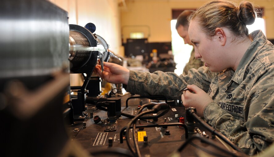 U.S. Air Force Airman Nicole Whisted, 35th Maintenance Squadron precision guided munitions crew member, connects an AIM-9 Sidewinder to a guidance control section unit test set at Misawa Air Base, Japan, July 26, 2013. To ensure this missile is mission ready, an inspection is performed every five years. (U.S. Air Force photo by Airman 1st Class Kia Atkins)