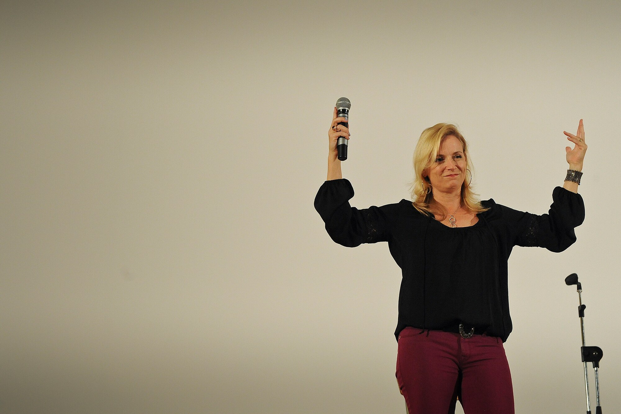 Comedienne Laura Hayden gestures a command during her performance at the 386th Air Expeditionary Wing Saturday, July 20, 2013.  (U.S. Air Force Photo by 1st Lt. Nathan Wallin)