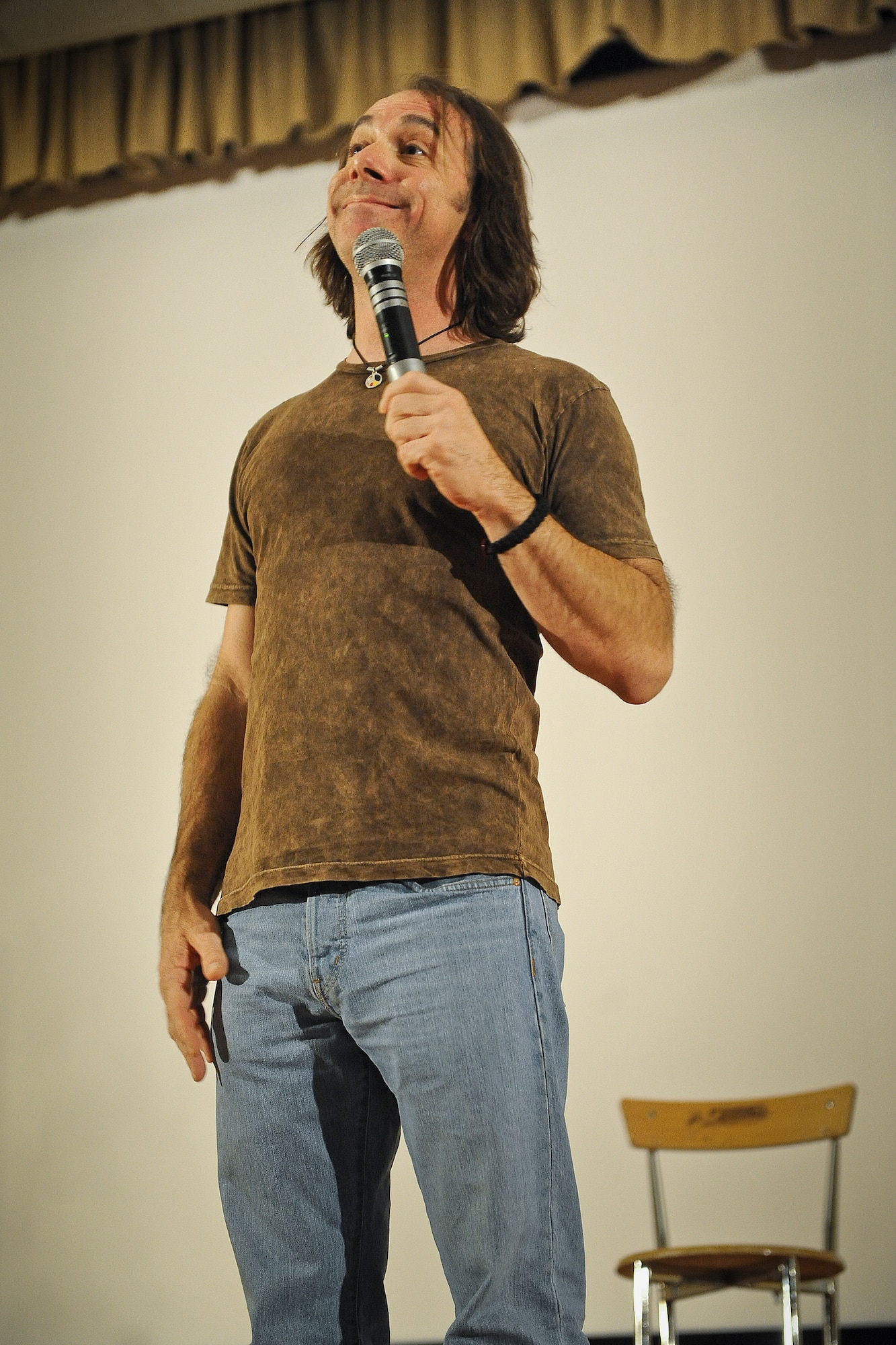 Comedian Jeff Capri pauses for effect during his performance at the 386th Air Expeditionary Wing, Saturday, July 20, 2013.  (U.S. Air Force Photo by 1st Lt. Nathan Wallin)