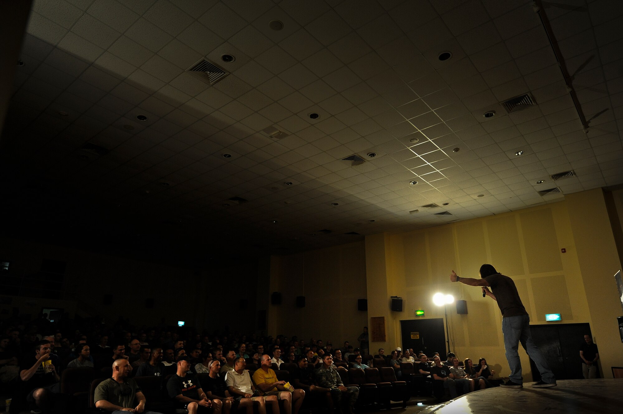 Comedian Jeff Capri entertains the Airmen of the 386th Air Expeditionary Wing during a performance by the Don Barnhart All-Star Comedy troupe, Saturday, July 20, 2013.  
“We’re so happy to be here at “The Rock,” this is very cool.” (U.S. Air Force Photo by 1st Lt. Nathan Wallin)
