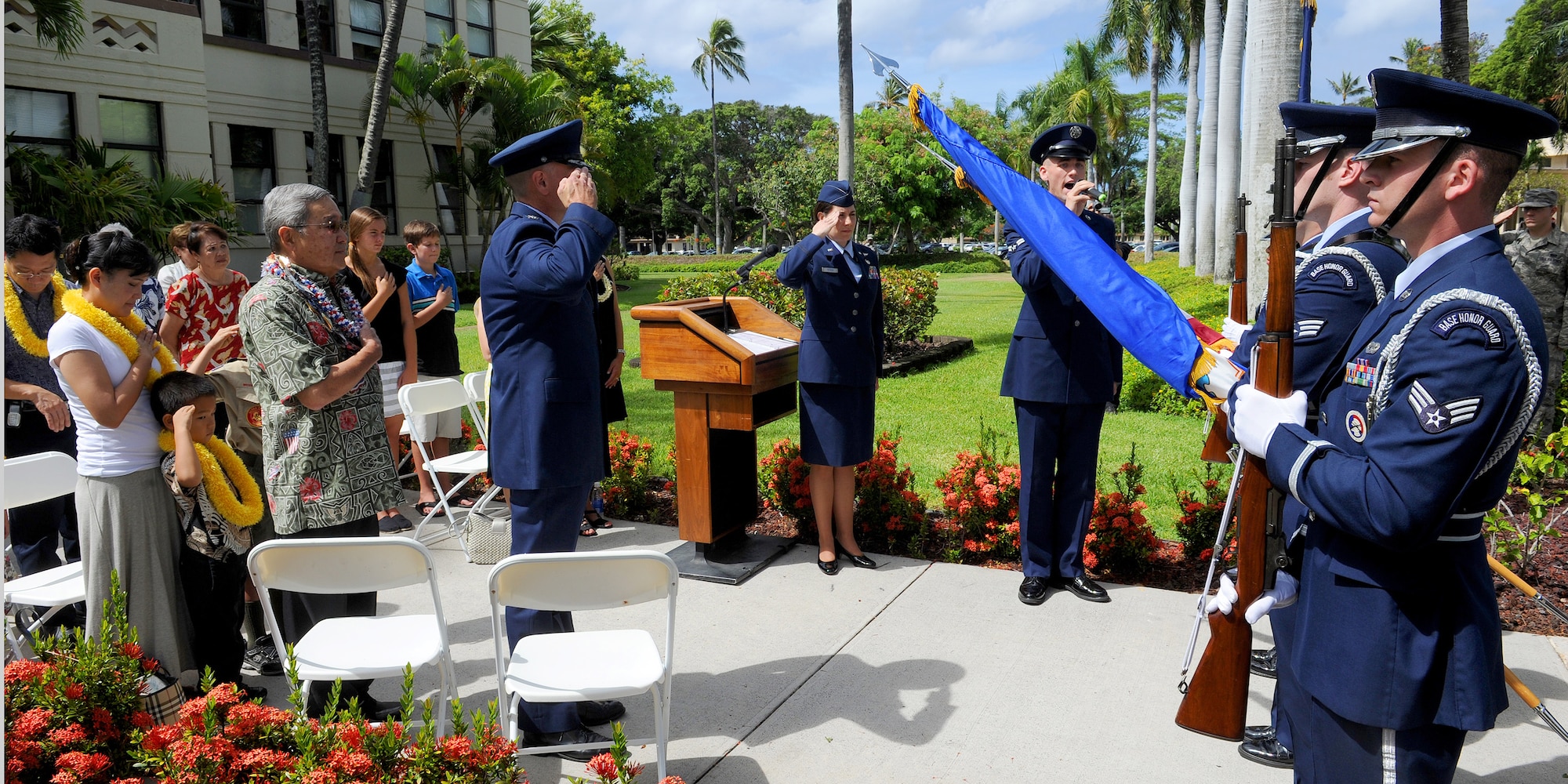 Members of the 15th Wing Honor Guard present the colors during the singing of the national anthem at a Bronze Star medal ceremony in honor of former U.S. Army Capt. Myron “Skip” Kawakami at the 15th WG headquarters building on Joint Base Pearl Harbor-Hickam, Hawaii, July 26, 2013. (U.S. Air Force photo/Tech. Sgt. Jerome S. Tayborn)