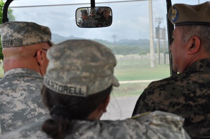 U.S. Army Col. John E. Cena, Joint Task Force Bravo Army Support Activity commander, left, gives Honduran Brig. Gen. Diaz (U.S. four-star equivalent) Andres Felipe Diaz Lopez, Presidential Honor Guard commander, right, a base tour as Cadet Beatriz Martorell, West Point junior, center, translates July 24, 2013. Martorell had the unique opportunity to return to her home country and perform Cadet Leadership Training at the Honduran Presidential House as well at Soto Cano Air Base. (Photo released by U.S. Air Force Staff Sgt. Jarrod R. Chavana) 