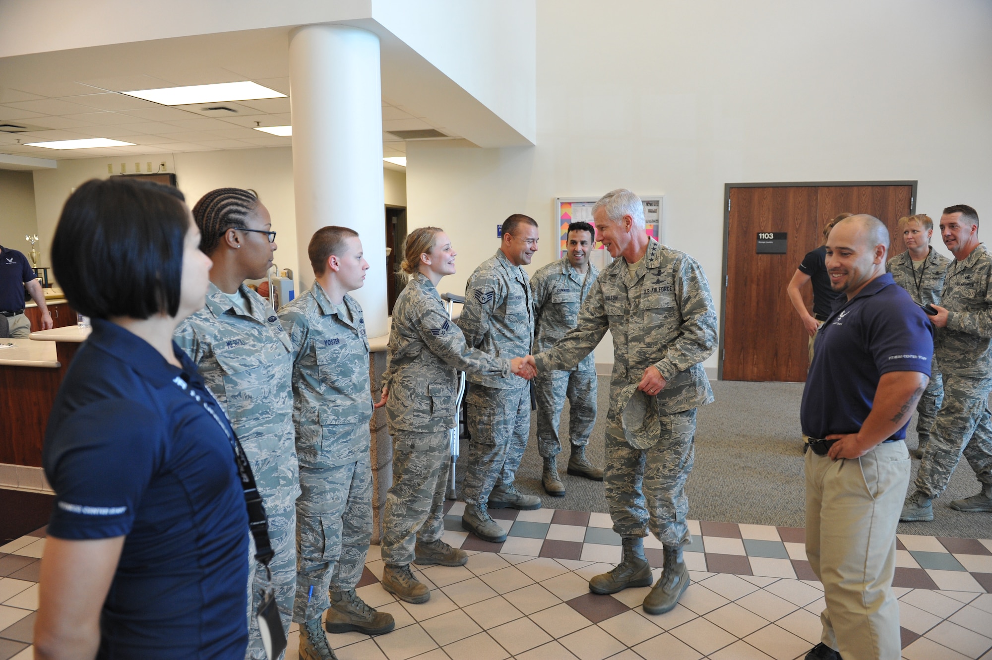 Gen. William Shelton, Air Force Space Command commander, greets members of the fitness center staff prior to a facility tour July 23, on Buckley Air Force Base, Colo. The fitness center offers a variety of classes and programs to Airmen, their families and other eligible guests. (U.S. Air Force photo by Airman 1st Class Riley Johnson/Released)
