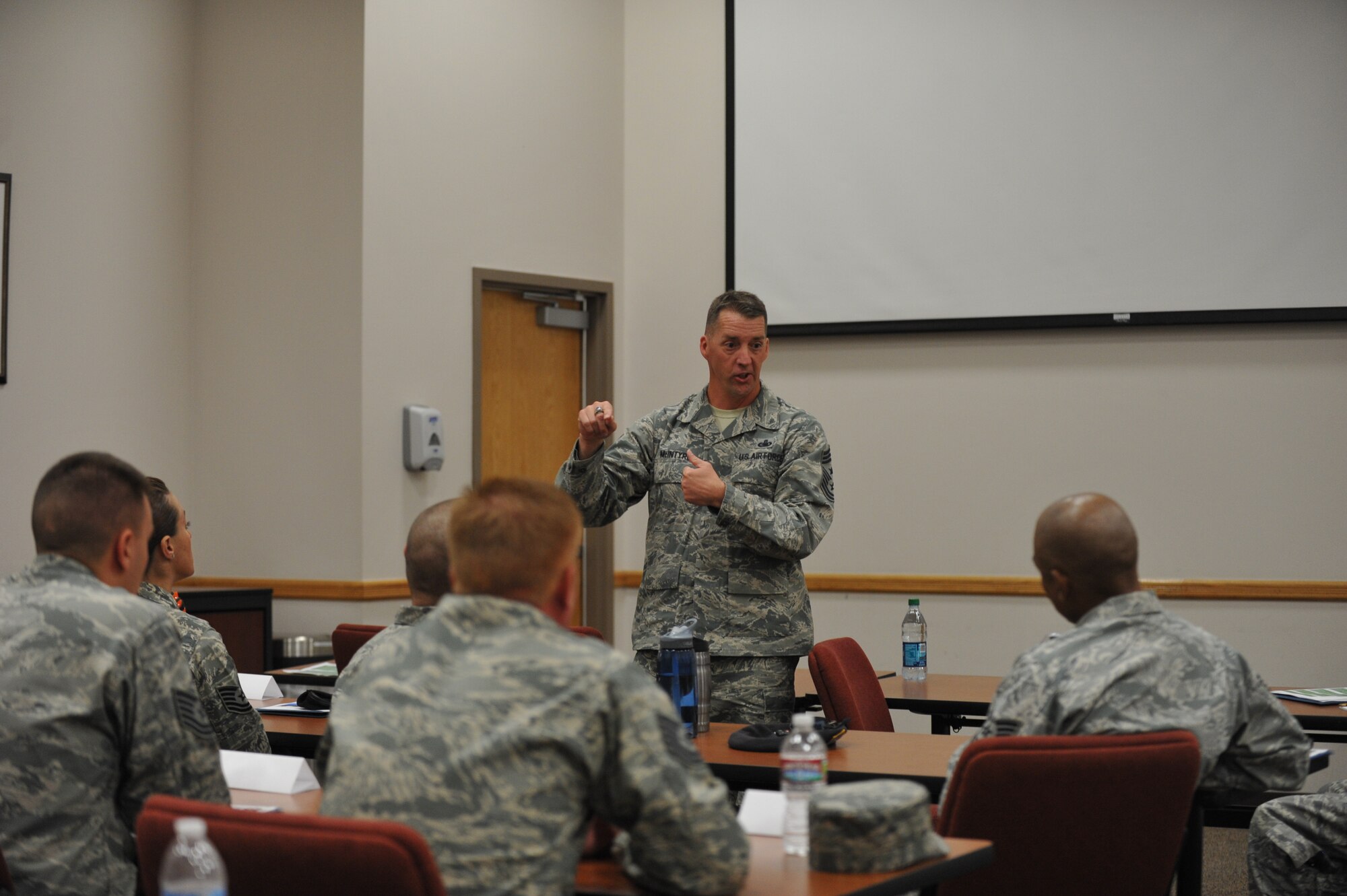 Chief Master Sgt. Douglas McIntyre, Air Force Space Command command chief, speaks with Senior NCO Inductees July 23, 2013, on Buckley Air Force Base, Colo. McIntyre discussed a variety of  topics including the impact of being a leader. (U.S. Air Force photo by Airman 1st Class Riley Johnson/Released)