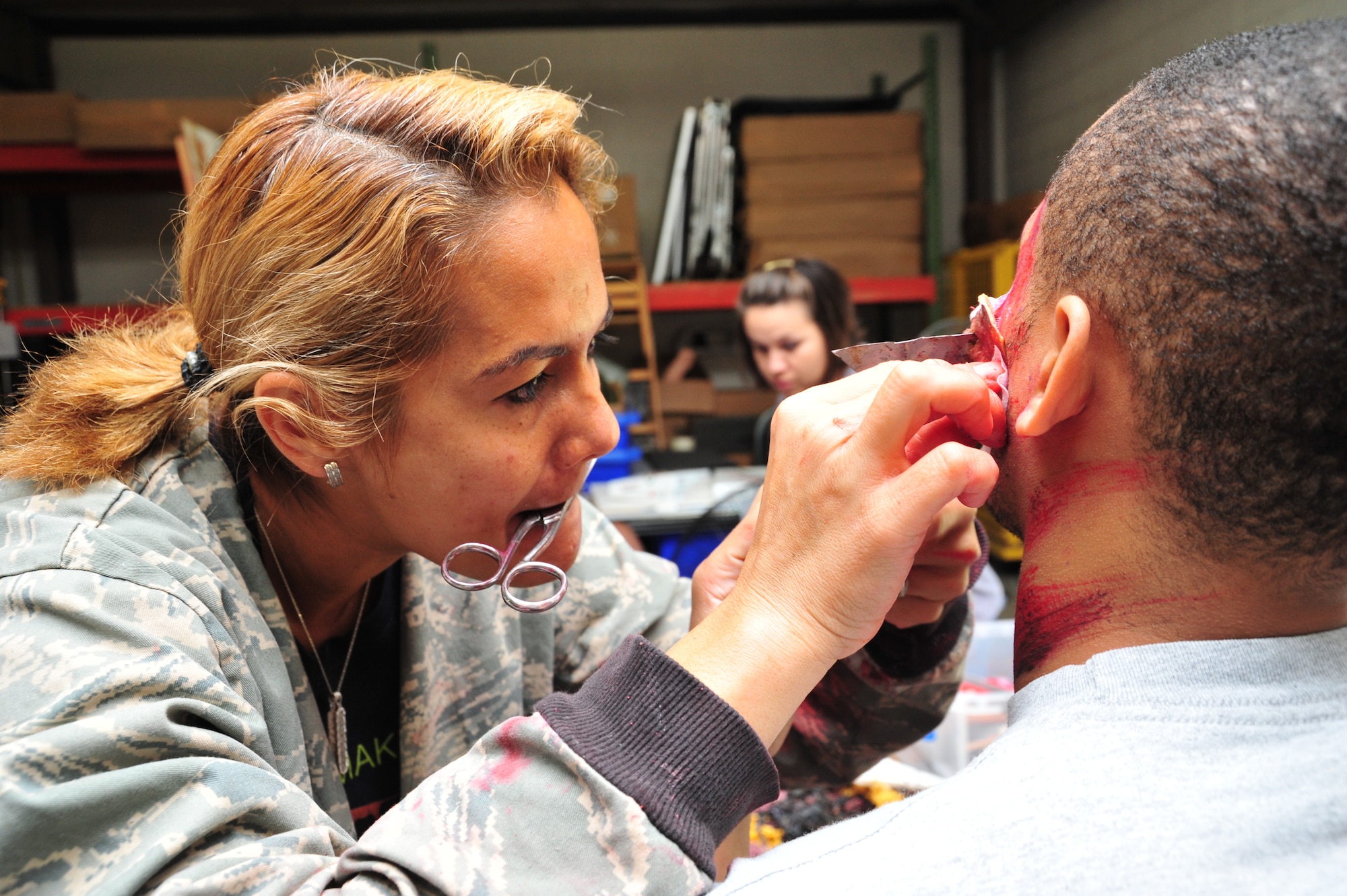 Aeromedical Staging Squadron, May 4, 2013, Keesler Air Force Base, Miss. Bunce volunteers as part of the 403rd Wing’s moulage team, which applies mock injuries for the purpose of training wing members to respond to medical emergencies. Todd acted as a victim in a mass casualty exercise during the 403rd Wing May unit training assembly. The exercise was part of the wing’s operational readiness exercise that took place May 3-4. The ORE tested the wing’s ability to mobilize and operate in a deployed environment. (U.S. Air Force photo by Tech. Sgt. Ryan Labadens)