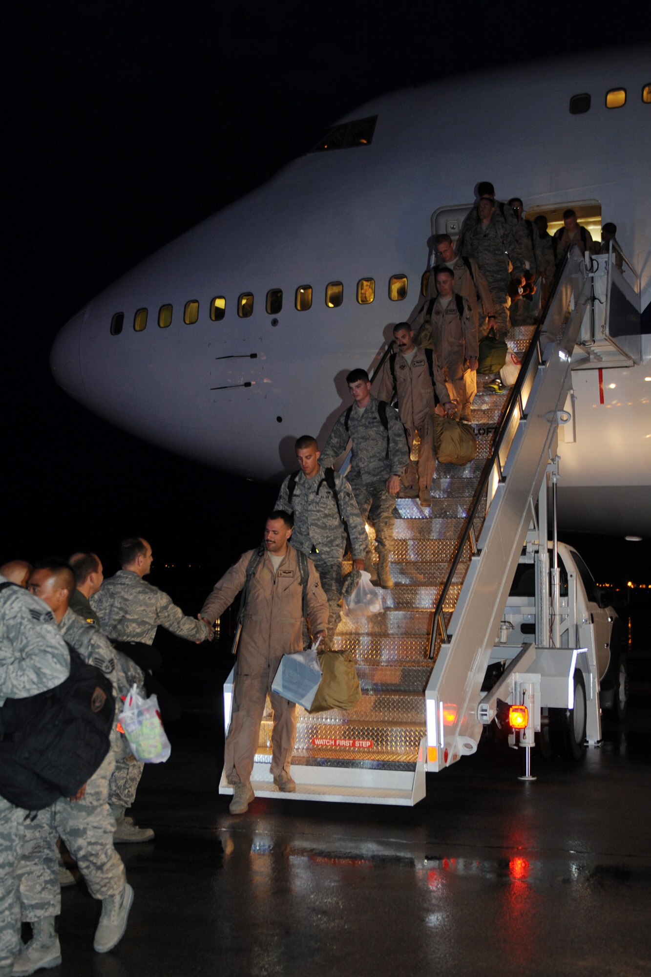 Airmen arriving home from deployment are greeted by base leaders at the Pride Hangar on Ellsworth Air Force Base, S.D., July 26, 2013. Nearly 400 Airmen returned from a six-month deployment to Southwest Asia where they conducted B-1 bomber missions.  (U.S. Air Force photo by Airman 1st Class Rebecca Imwalle/Released)