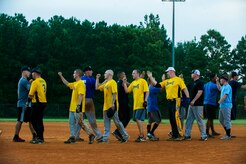 Players from the 437th Maintenance Squadron and 628th Security Forces Squadron shake hands after the Intramural Softball Base Championship game July 13, 2013, at Joint Base Charleston – Air Base, S.C. The 437th MXS defeated the 628th SFS 14 – 11. (U.S. Air Force photo/Senior Airman George Goslin) 