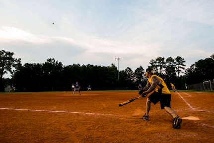 Clifford Hartley, 628th Security Forces Squadron, drives a ball to the outfield, during the Intramural Softball Championship Game against the 437th Maintenance Squadron July 24, 2013 at Joint Base Charleston – Air Base, S.C. The 437th MXS defeated the 628th SFS 14 – 11. (U.S. Air Force photo/Senior Airman George Goslin)