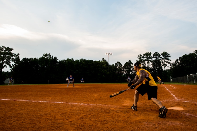 Clifford Hartley, 628th Security Forces Squadron, drives a ball to the outfield, during the Intramural Softball Championship Game against the 437th Maintenance Squadron July 24, 2013 at Joint Base Charleston – Air Base, S.C. The 437th MXS defeated the 628th SFS 14 – 11. (U.S. Air Force photo/Senior Airman George Goslin)