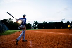 Josh Thomas, 437th Maintenance Squadron stortstop, takes batting practice before the Intramural Softball Championship Game July 24, 2013, at Joint Base Charleston – Air Base, S.C. The 437th MXS defeated the 628th Security Forces Squadron 14 – 11, for the championship. (U.S. Air Force photo/Senior Airman George Goslin)