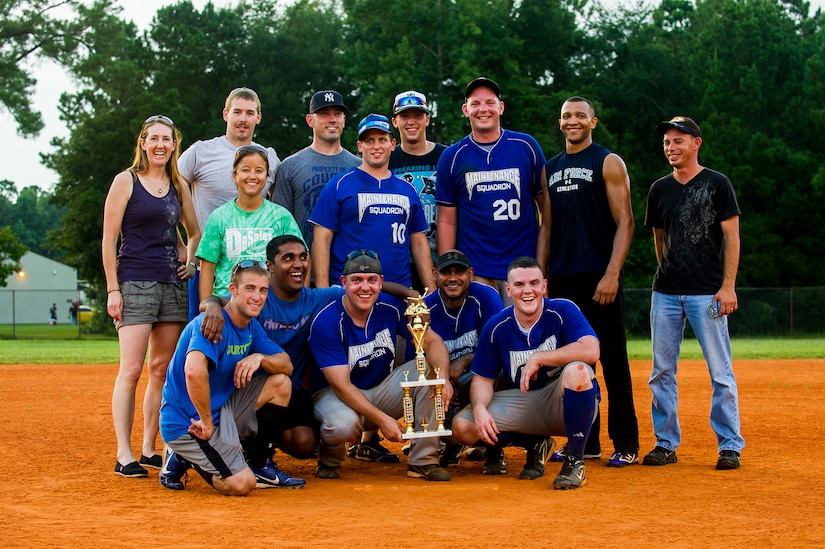 Players and fans from the 437th Maintenance Squadron pose after winning the Intramural Softball Championship Game against the 628th Security Forces Squadron July 24, 2013, at Joint Base Charleston – Air Base, S.C. 437th MXS defeated 628th SFS 14 – 11. (U.S. Air Force photo/Senior Airman George Goslin)