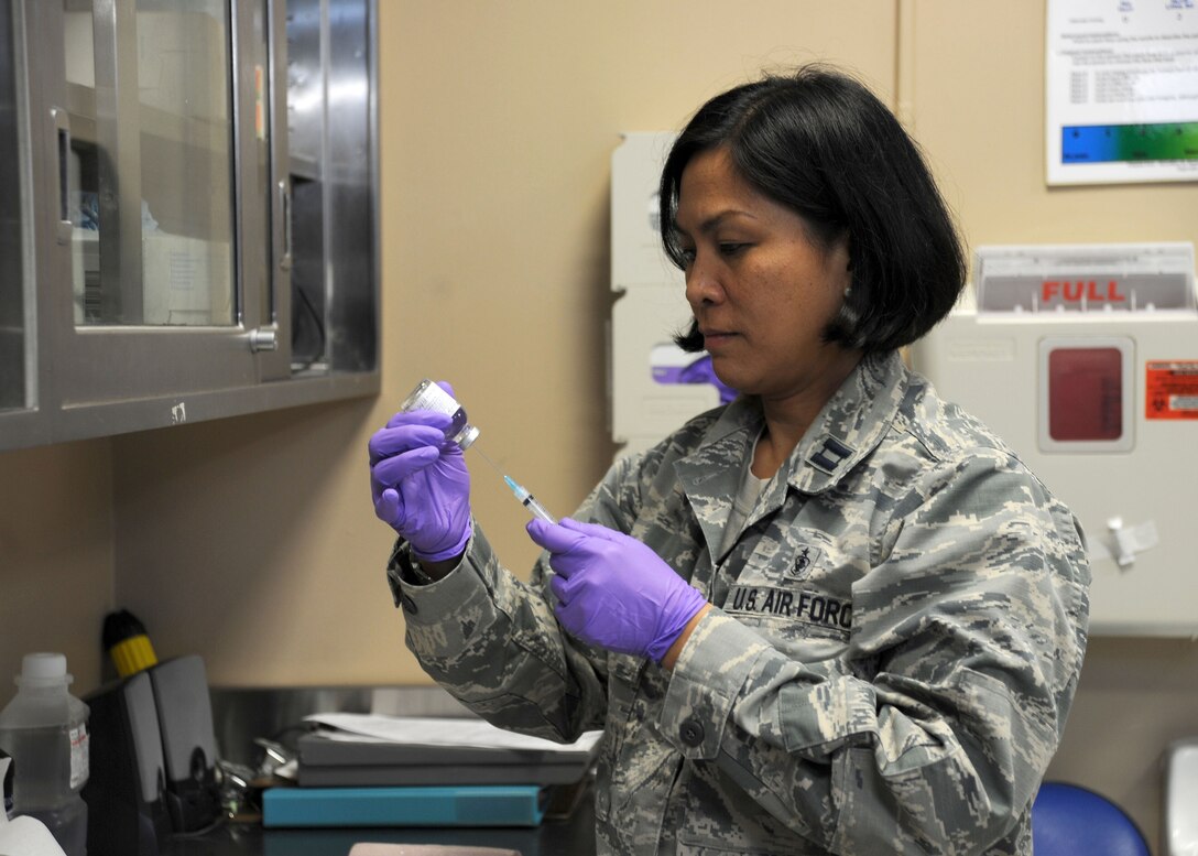 Capt. Maria Reyes, 779th Medical Group Surgeries Specialties Flight nurse manager, prepares to give a patient an injection at the Malcolm Grow Medical Clinic and Surgery Center on Joint Base Andrews, Md. Annually, the 779th MDG staff support more than 393,000 beneficiaries in the National Capital Region with 42 health care specialties. (U.S. Air Force photo Tech. Sgt. Tammie Moore)