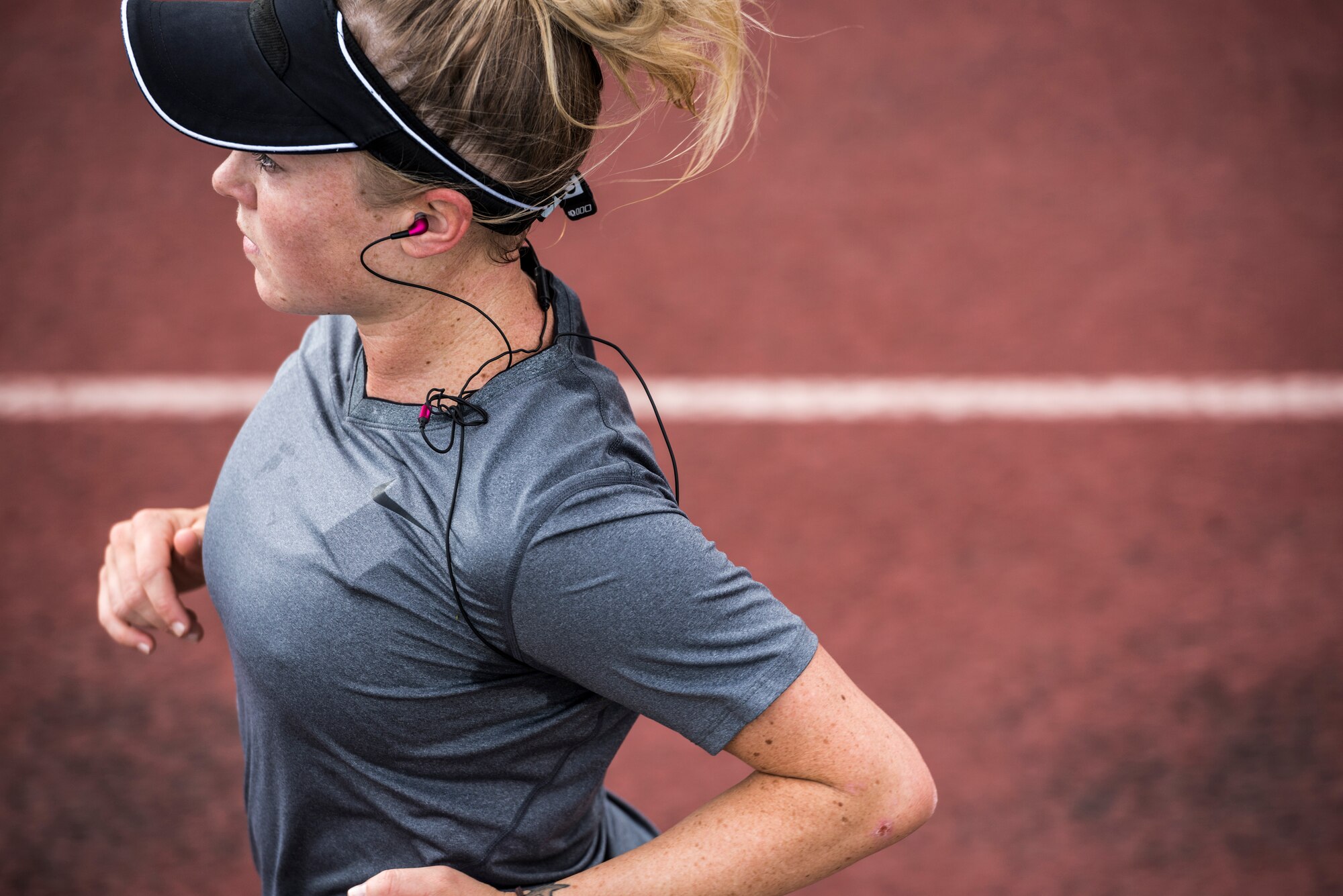 U.S. Air Force Senior Airman Megan Stanton, 366th Medical Operations Squadron medic, runs laps on the base track after a swim at Mountain Home Air Force Base, Idaho, July 11, 2013. (U.S. Air Force photo/Tech. Sgt. Samuel Morse)