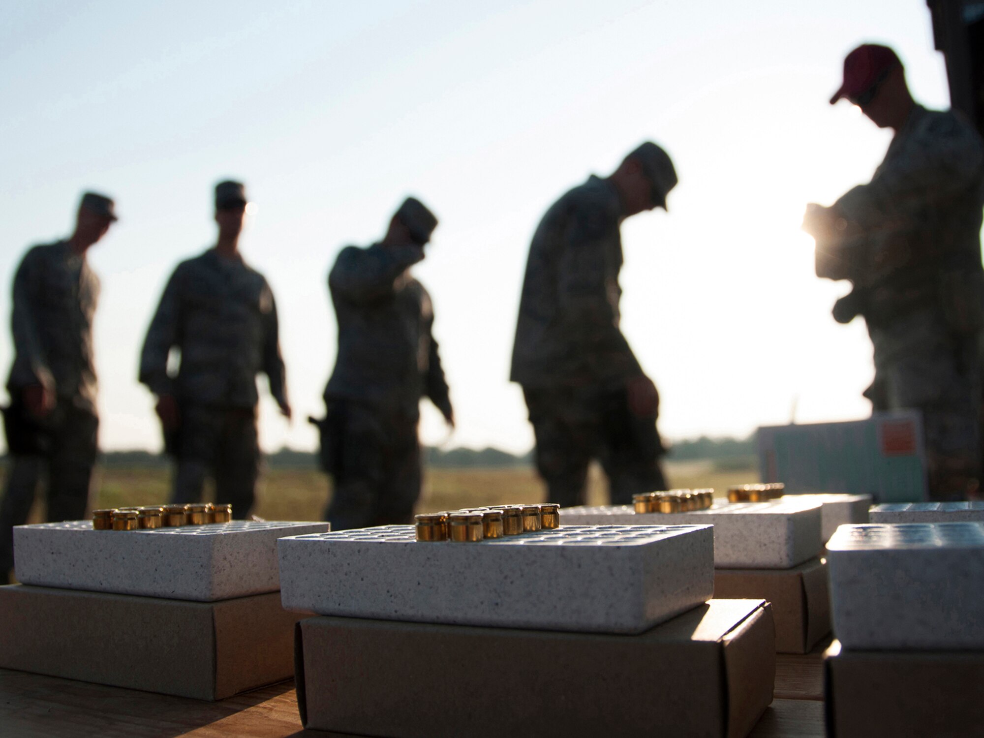 Security forces Airmen line up to receive ammo before firing the M9 pistol. Reservists from the 419th Security Forces Squadron trained at Fort Wolters alongside more than 60 Airmen from bases across the country. They received additional training on weapons, tactical movements and simulated base defense in a hostile location. (U.S. Air Force photo/Senior Airman Crystal Charriere)