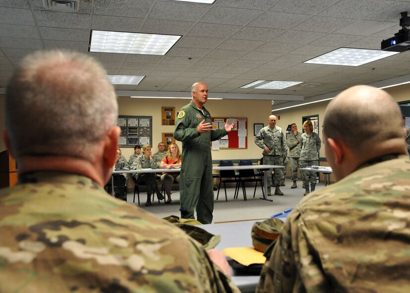 Col. J. Peter Hronek, 120th Fighter Wing commander, thanks 14 members of the 120th Security Forces Squadron for participating in a six-month overseas deployment in support of Operation Enduring Freedom. The Airmen were beginning their in-processing activities on July 16. (U.S. Air Force photo/Senior Master Sgt. Eric Peterson) 