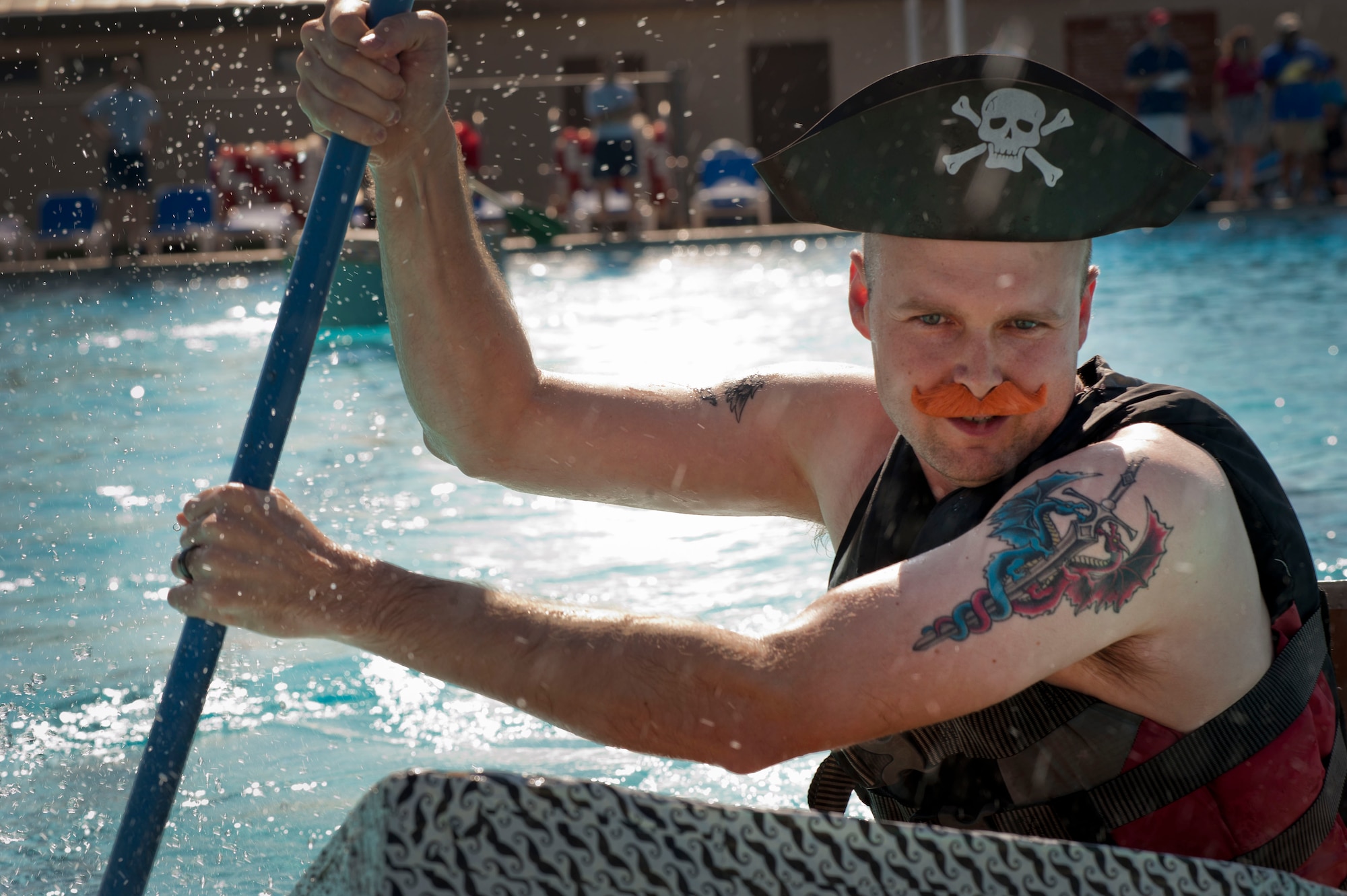 The annual build-a-boat competition took place July 20. Each contestant had to build boats made out of cardboard and eventually race them in the base pool. (U.S. Air Force photo by Airman 1st Class Jelani Gibson) 
