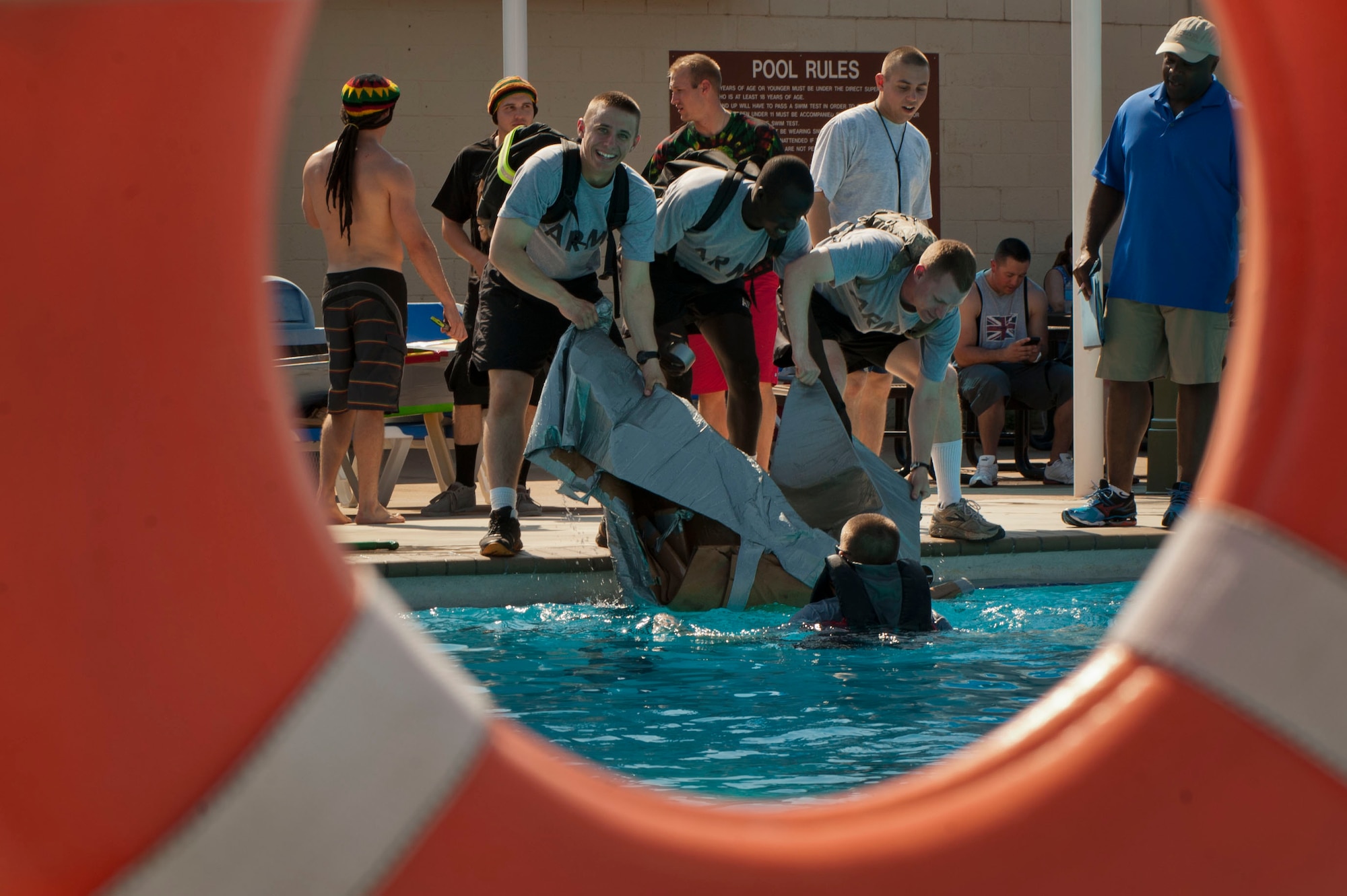 The annual build-a-boat competition took place July 20. Each contestant had to build boats made out of cardboard and eventually race them in the base pool. (U.S. Air Force photo by Airman 1st Class Jelani Gibson) 