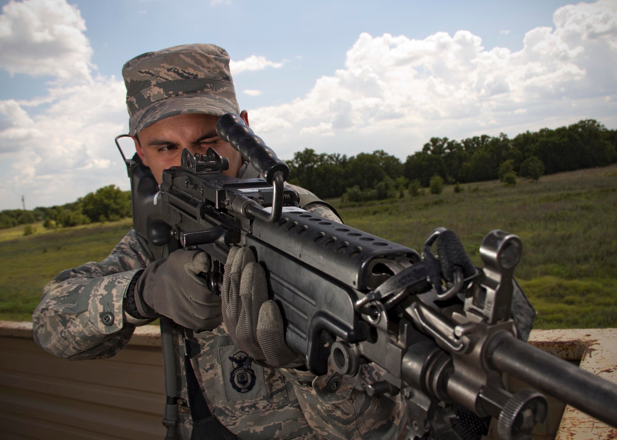 Senior Airman Ivan Velasquez, 419th Security Forces Squadron, stands guard during a base defense exercise. Velasquez was one of more than 60 Airmen from units across the country participating in the Patriot Defender training, including 14 reservists from the 419th Fighter Wing. The exercise keeps security forces reservists knowledgeable on procedures used during deployments. (U.S. Air Force photo/Tech Sgt. Richard Gonzales)