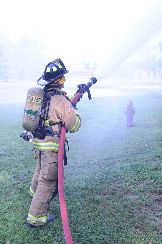 Airman 1st Class Jim Chavez, 11th Civil Engineer Squadron firefighter, practices control of the water hose as part of his training here at Joint Base Andrews, Md., July 24, 2013. Firemen train to be experts in each aspect of their job. (U.S. Air Force photo/Airman 1st Class Joshua R. M. Dewberry)